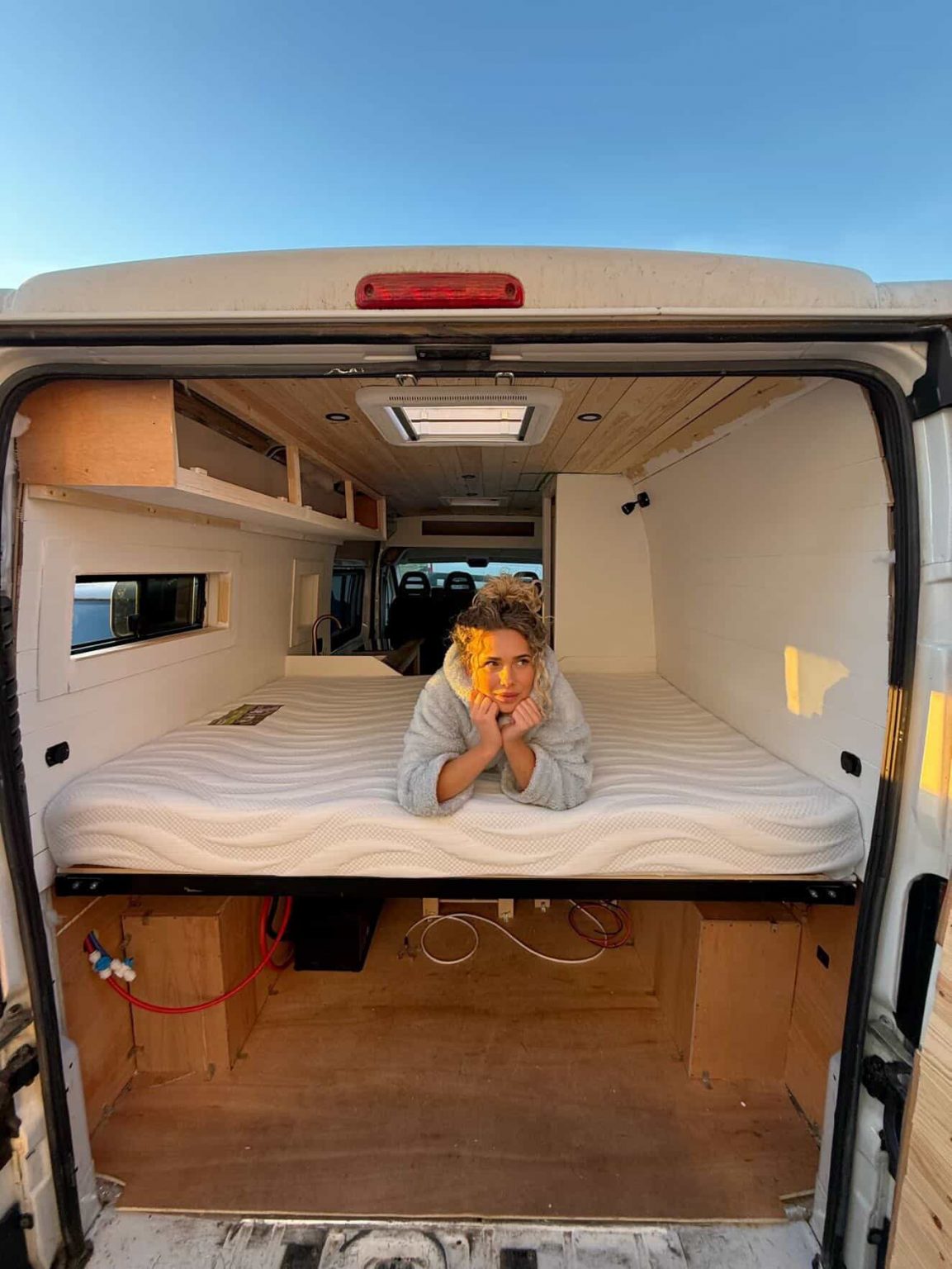 women lying on the standard caravan mattress